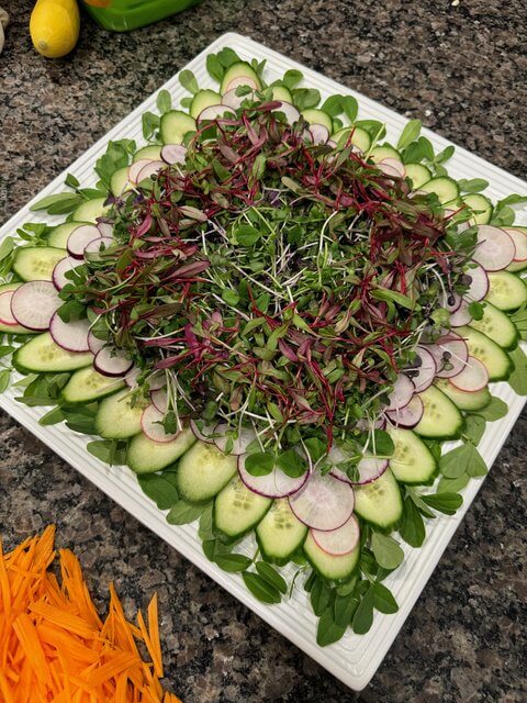 Microgreens added to the center of the platter